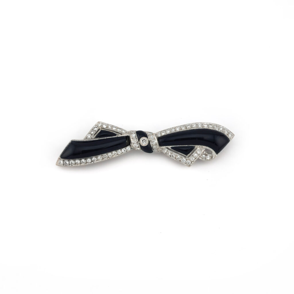 Schleifenbrosche aus 750er Gold, Diamanten und Onyx